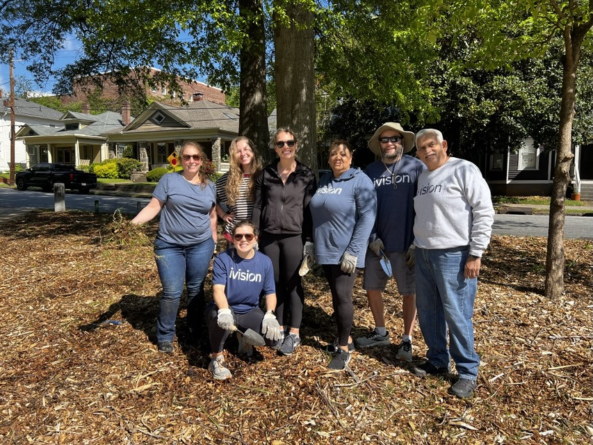 Team members volunteer for Earth Day. 
