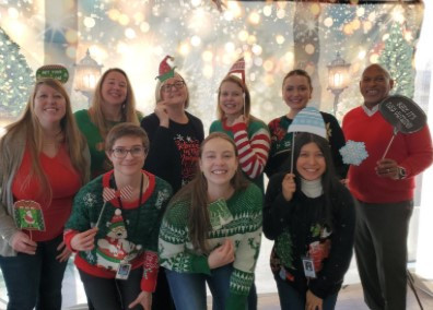 Holiday Sweater Fun- HR staff in festive ugly sweaters enjoying some well-earned holiday cheer in December 2024.