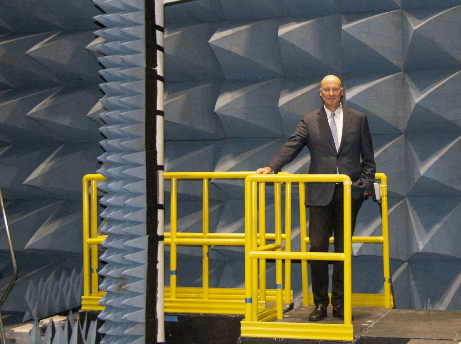 President and CEO Kevin Hair stands in a chamber used to measure and calibrate our radar and communications systems.