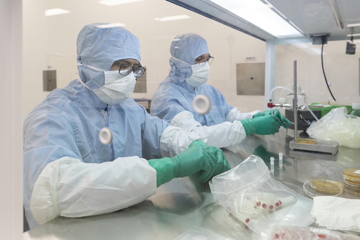 CooperSurgical Labtech employees working and wearing masks for COVID safety.