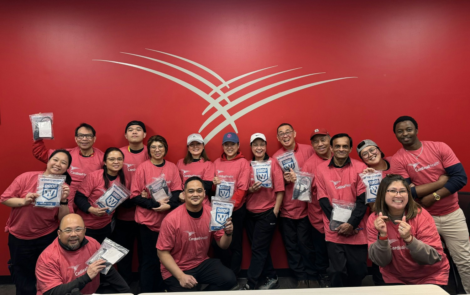 Cardinal Health Canada employees put together clean water filters that will be sent to communities around the world. 