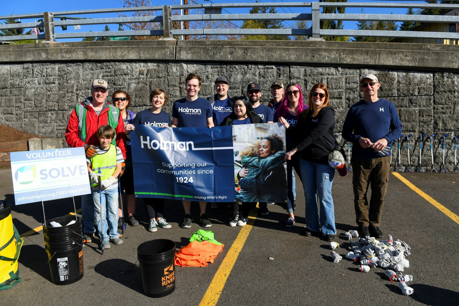 Holman partners participating in Earth Day event where they collected 50 bags of litter and debris.