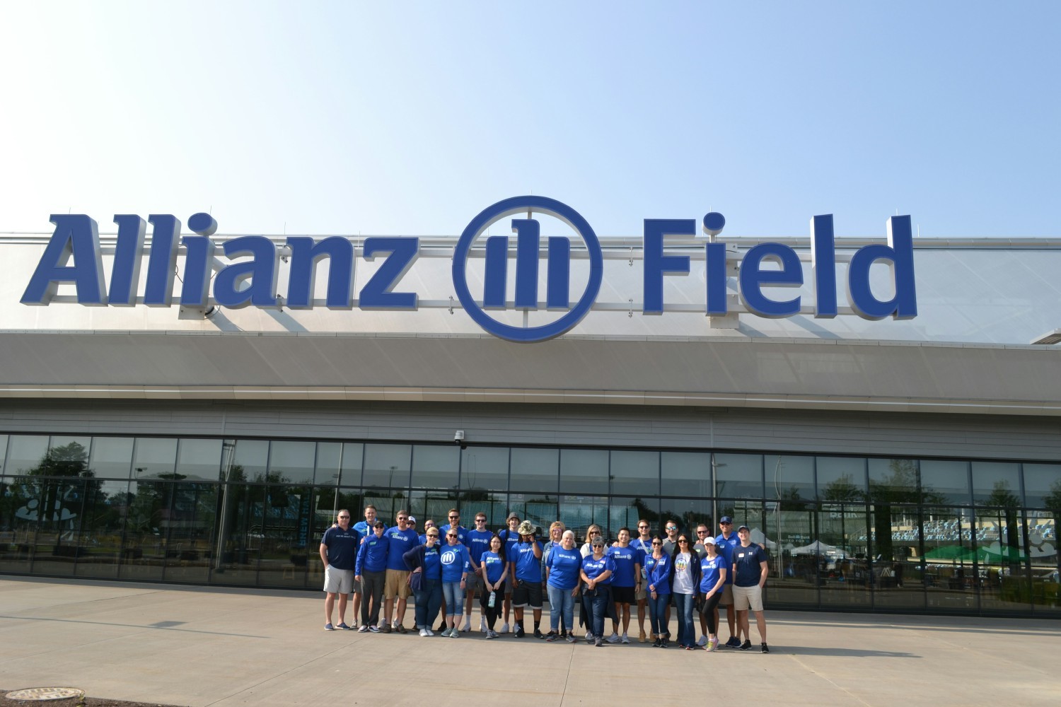 Employees volunteer at the Free Farmer's Market outside of Allianz Field.