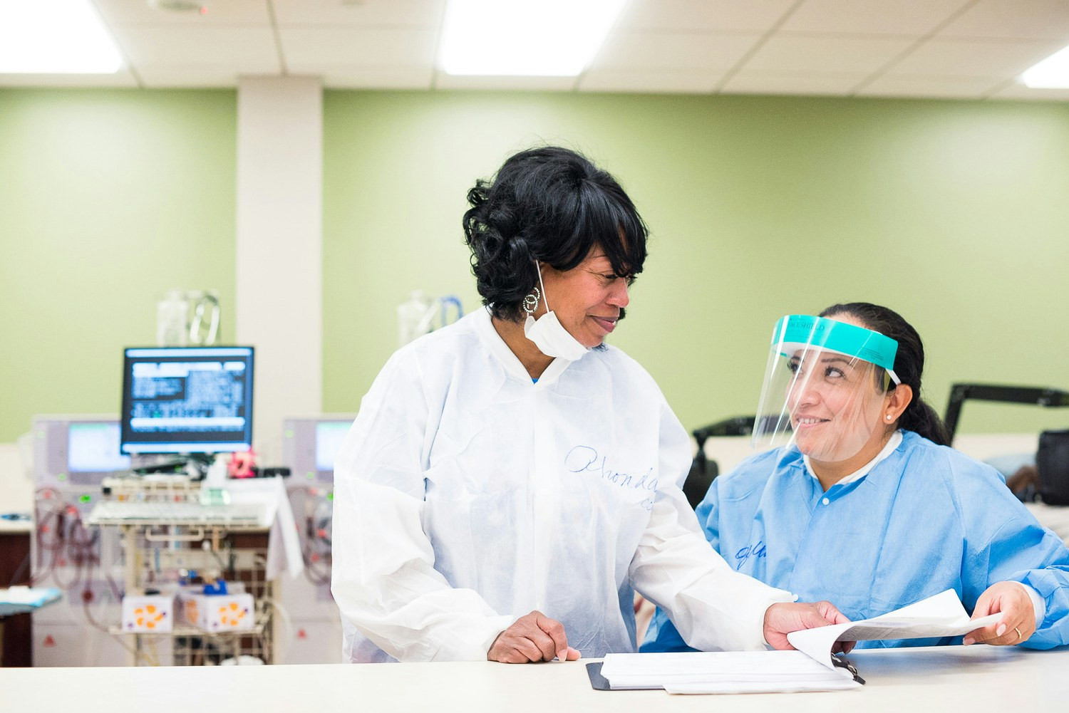 Two DaVita teammates sharing a special moment during work.