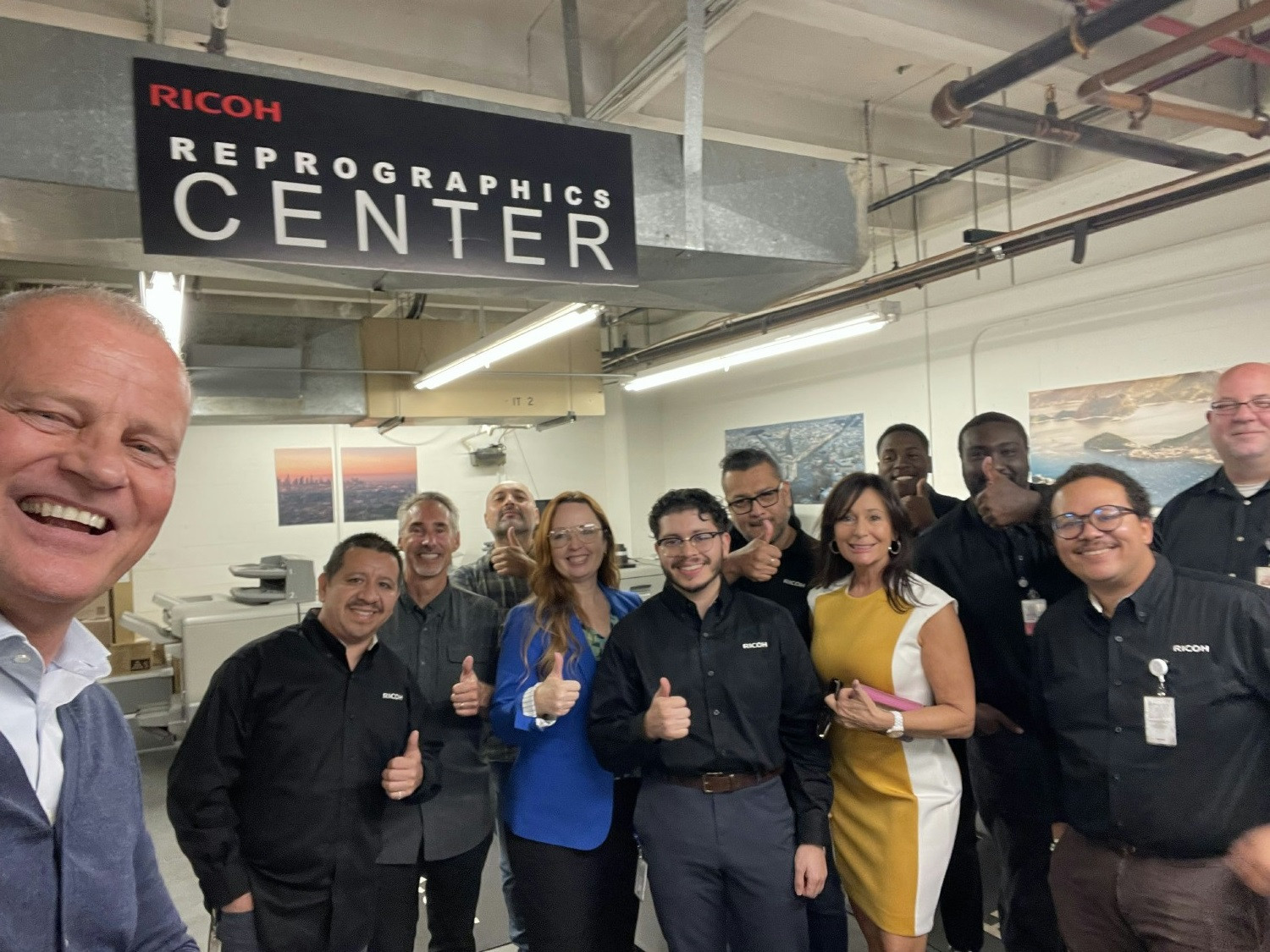 Ricoh North America CEO Carsten Bruhn visiting Ricoh team members on location at a customer facility