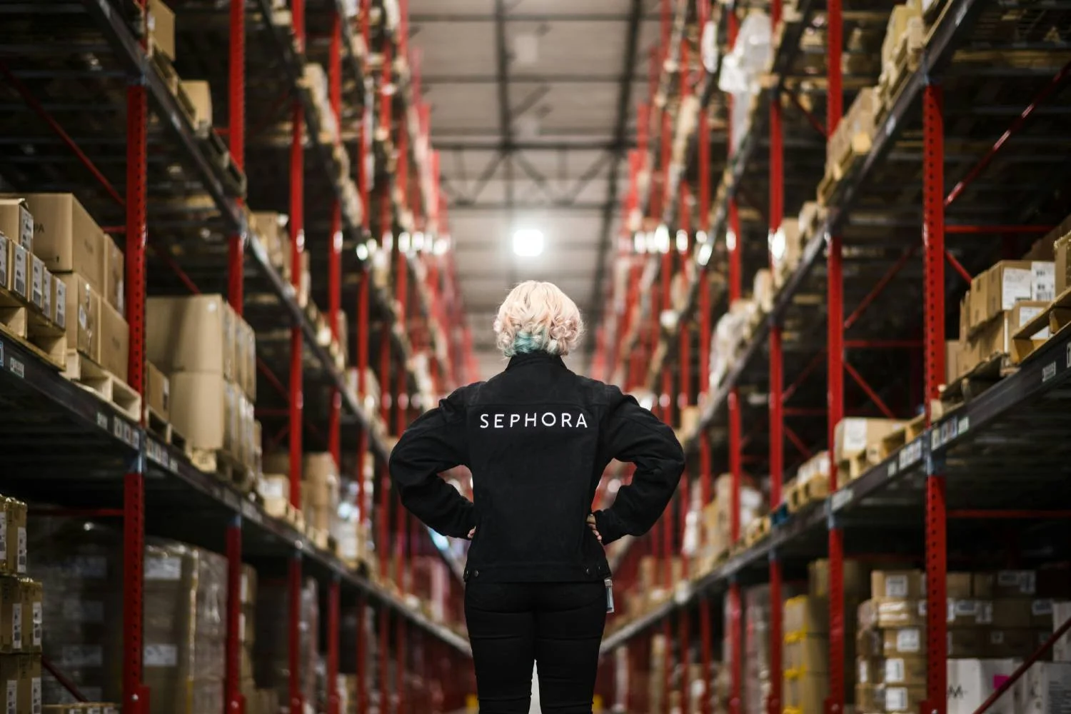 Employee standing at one of Sephora's distribution centers.
