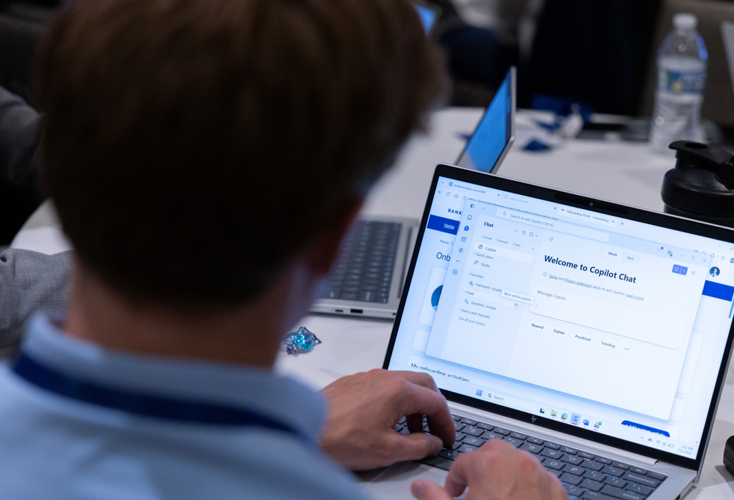 A BofA teammate participates in a training event delivered by The Academy as part of the M365 rollout.