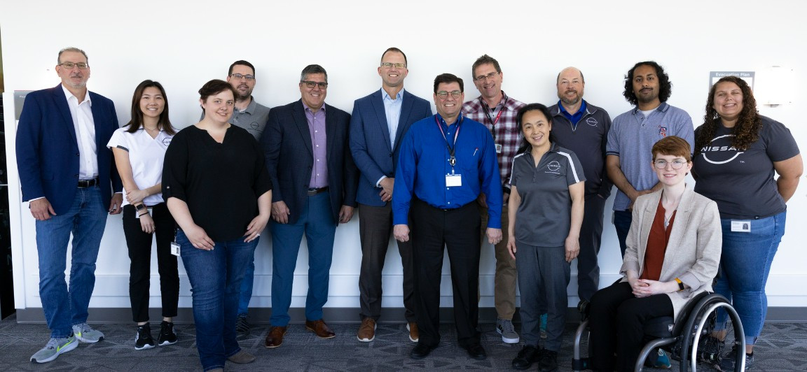 A diverse team unites, in formal and casual roles.