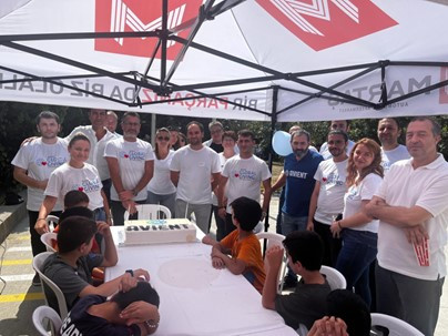 Associates in Turkey host children and teachers from a community home for fun and games, and provide school supplies