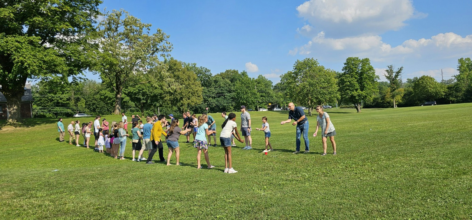 Vector Picnic water balloon contestants show off their throwing skills.