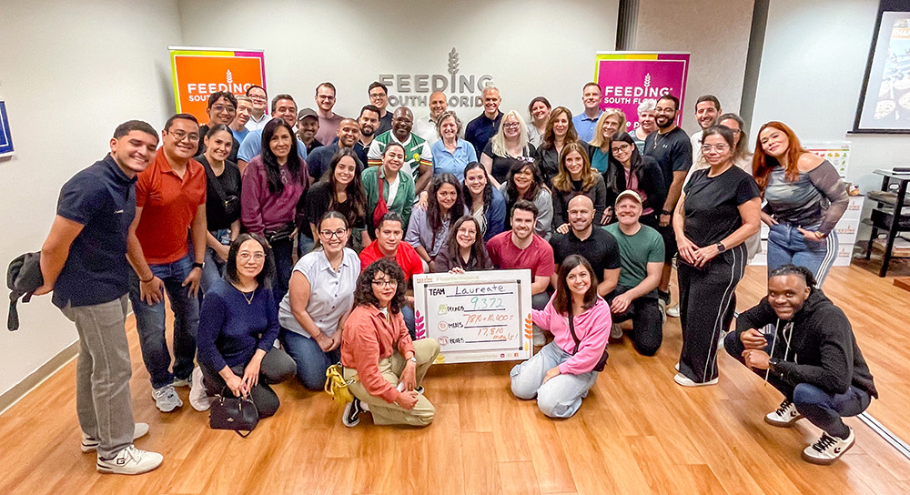 The corporate team concluding a volunteering activity with Feeding South Florida in December 2025