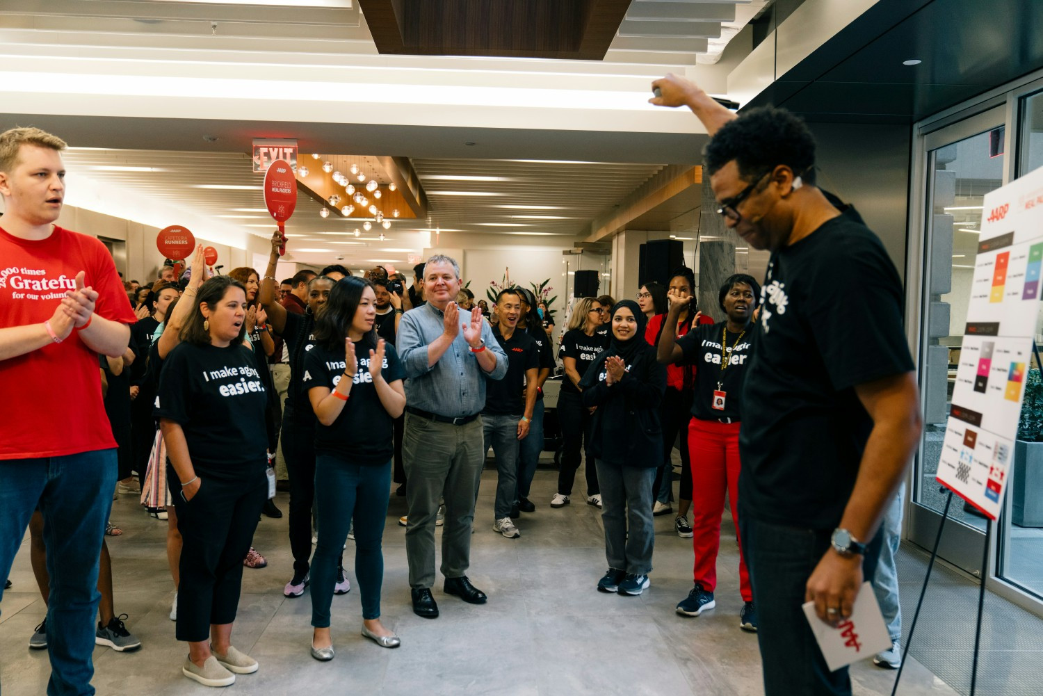 AARP staff gearing up for the Day of Service Meal Pack event, ready to serve and make an impact within the DC community.