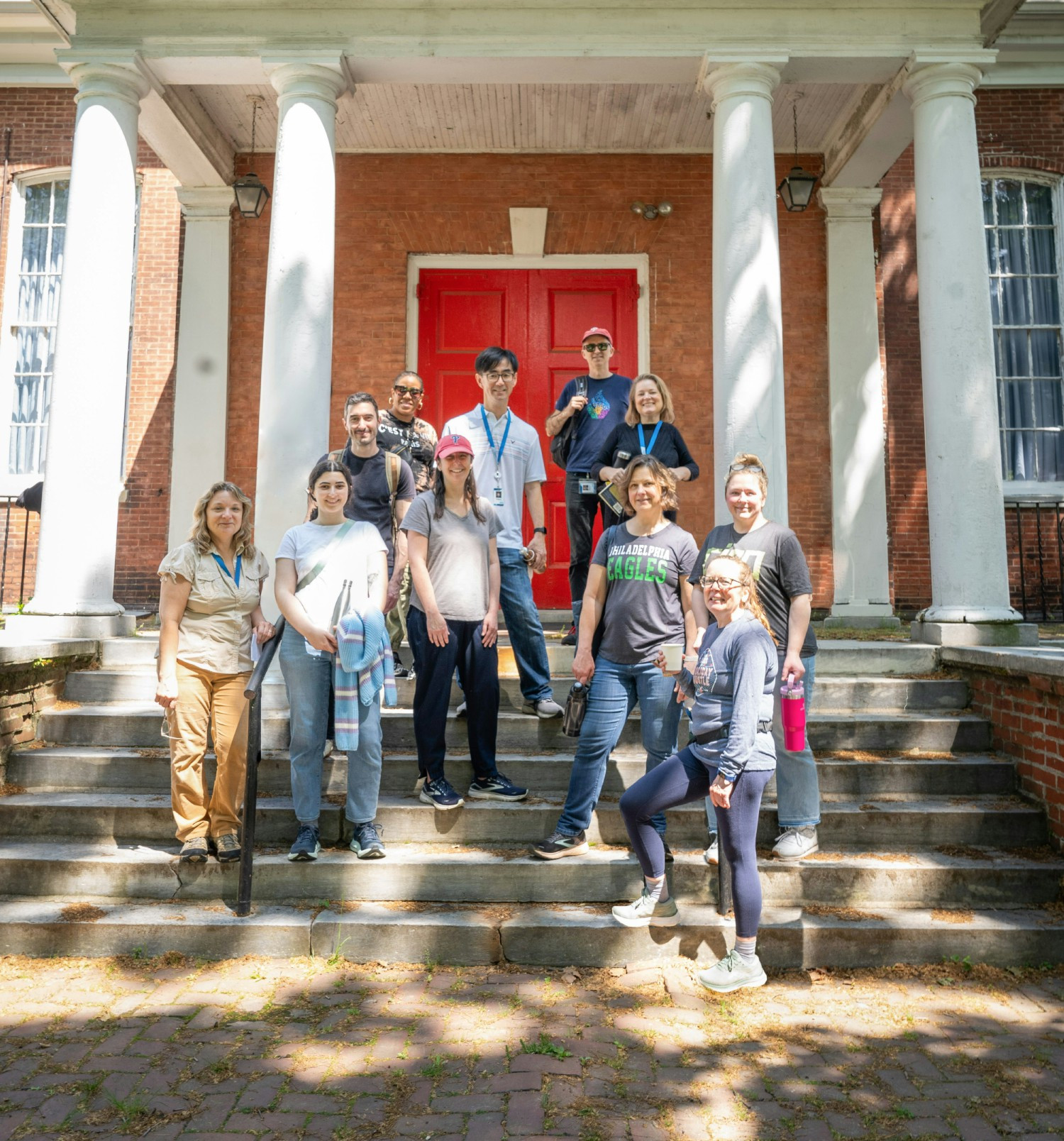 A team poses for a photo after a good day’s work of volunteering at a local food pantry.