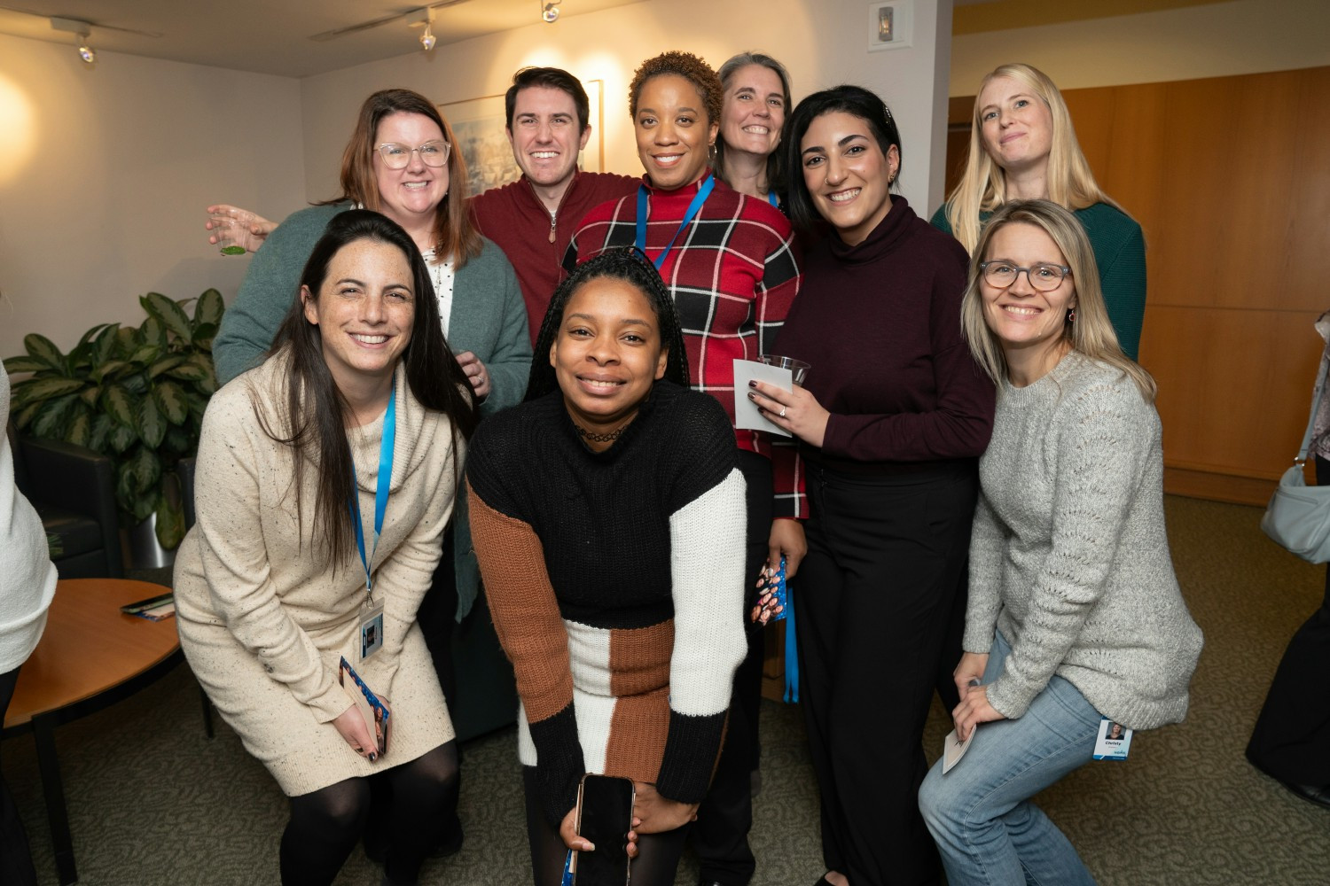 A team stops for a photo before joining an activity during an all staff event.