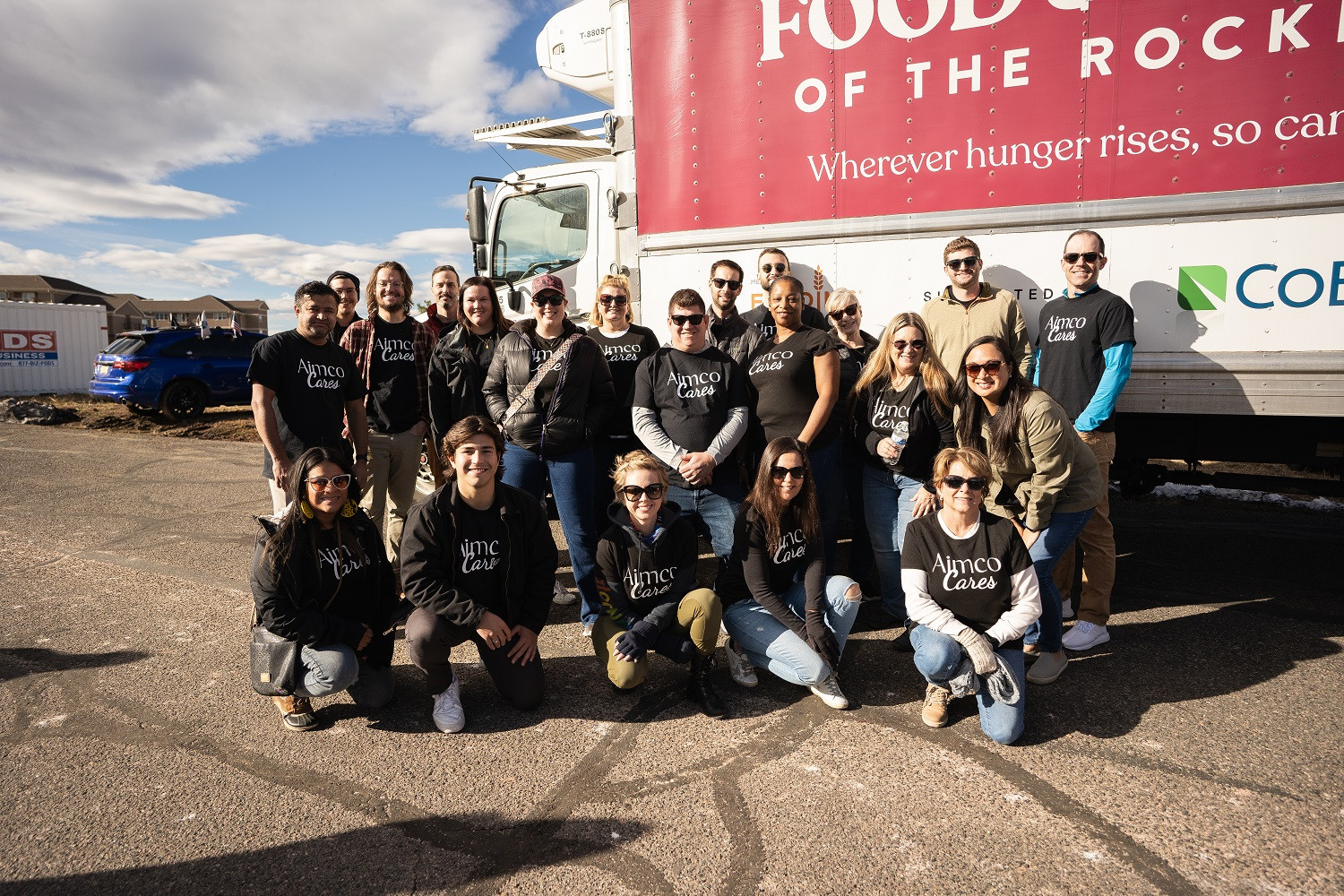The Denver Aimco team participating at a mobile-food drive for Aimco Cares. 