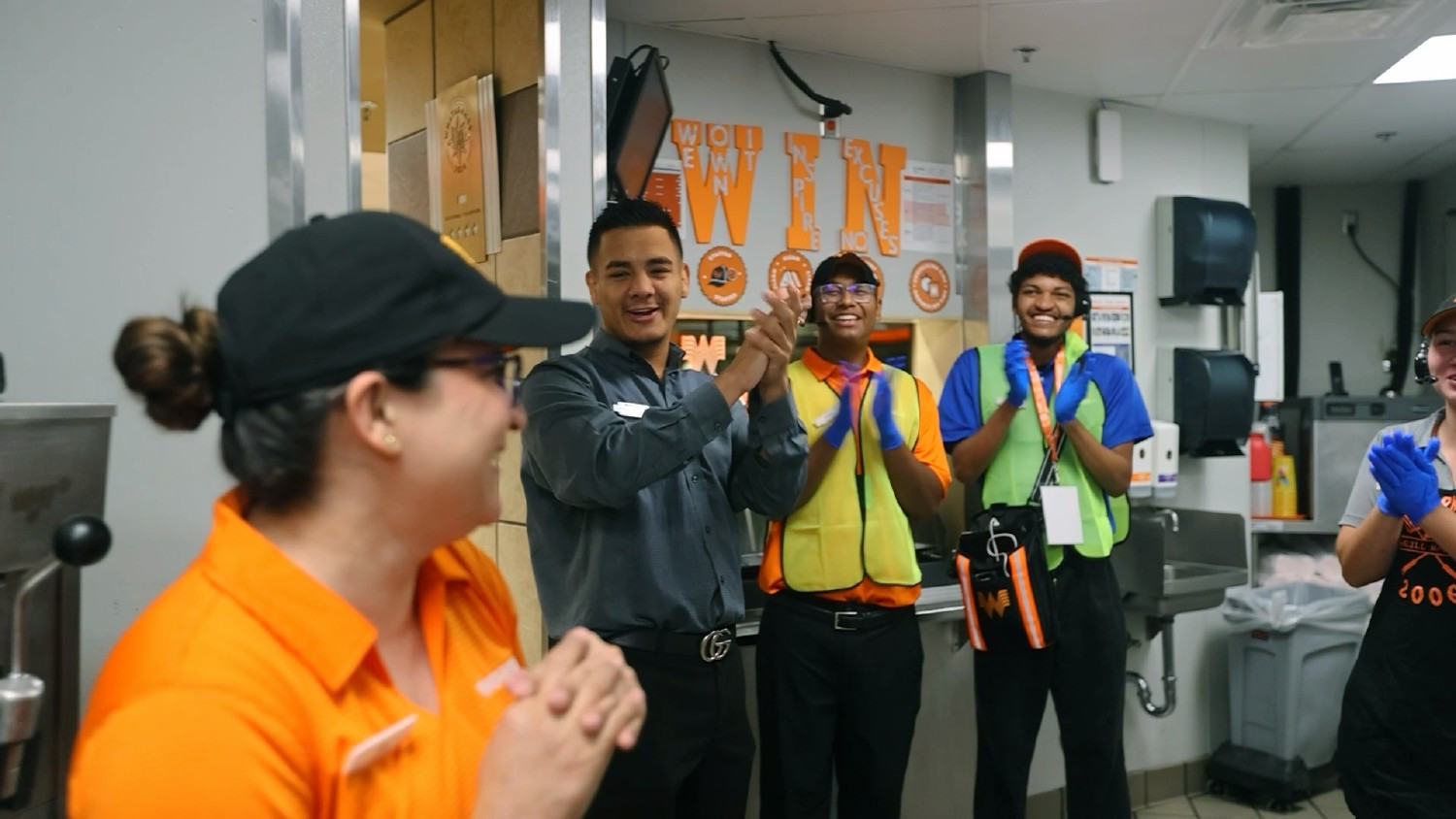 A Houston, Texas, Whataburger team celebrates a Family Member milestone, highlighting teamwork, recognition and support.