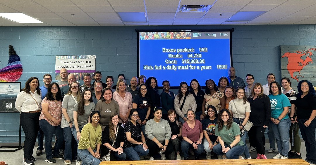 May 2024 - A group of team members using their annual volunteer time off hours to support Feed My Starving Children.