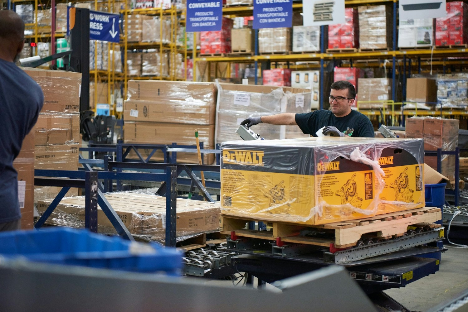 Supply Chain associate using a forklift to move products.