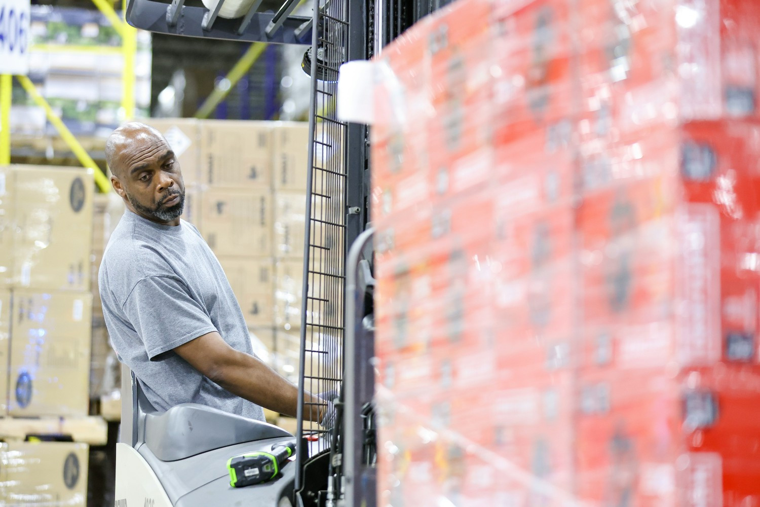 Supply Chain Associate using a forklift to move products