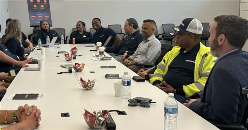 Chairman and CEO, Dennis Mathew, meets with employees. 