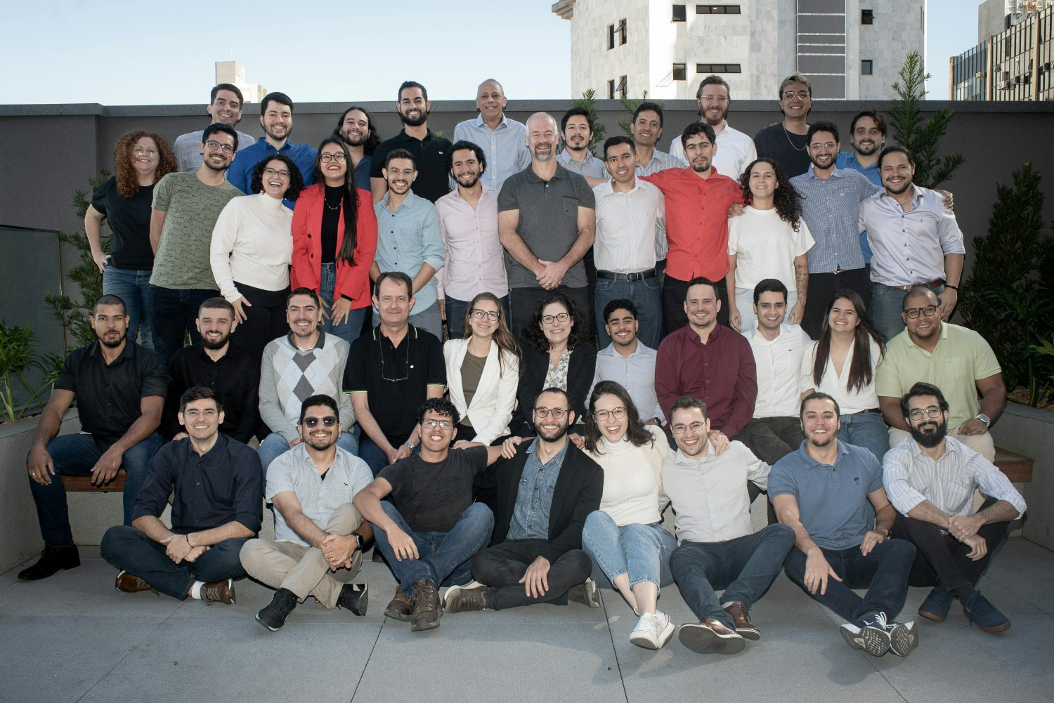 Employees in Brazil gathering for a team building event