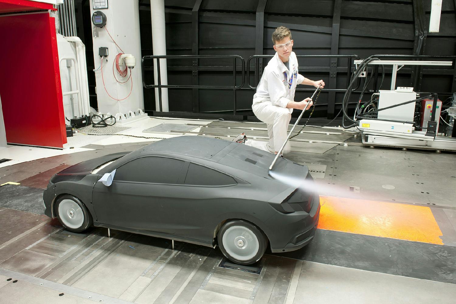 Associate conducting aerodynamic research in the scale model wind tunnel.
