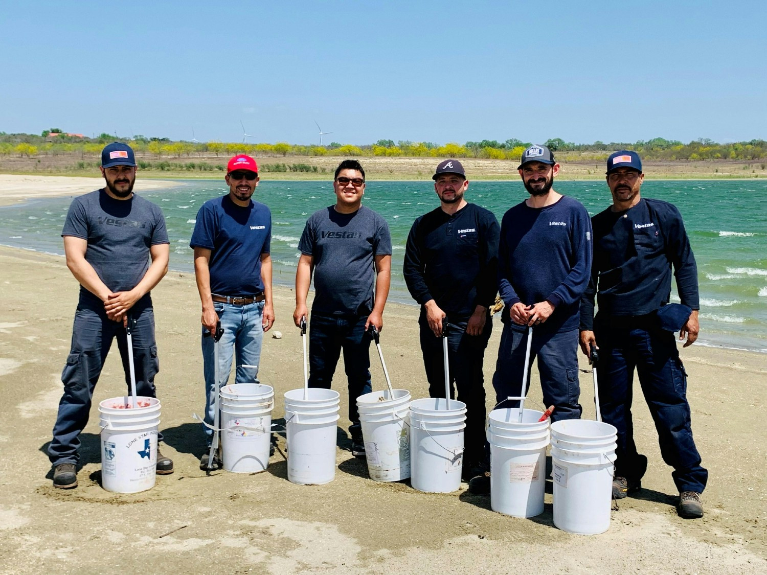 Members of Vestas’ Service team from the Rio Bravo wind farm in Texas clean-up debris at Falcon State Park for Earth 