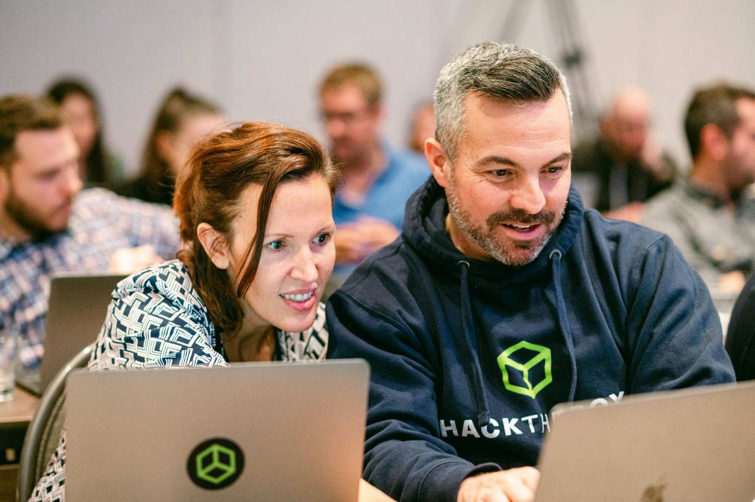 Sales Representatives from Hack The Box's Australian and U.S. teams working together 