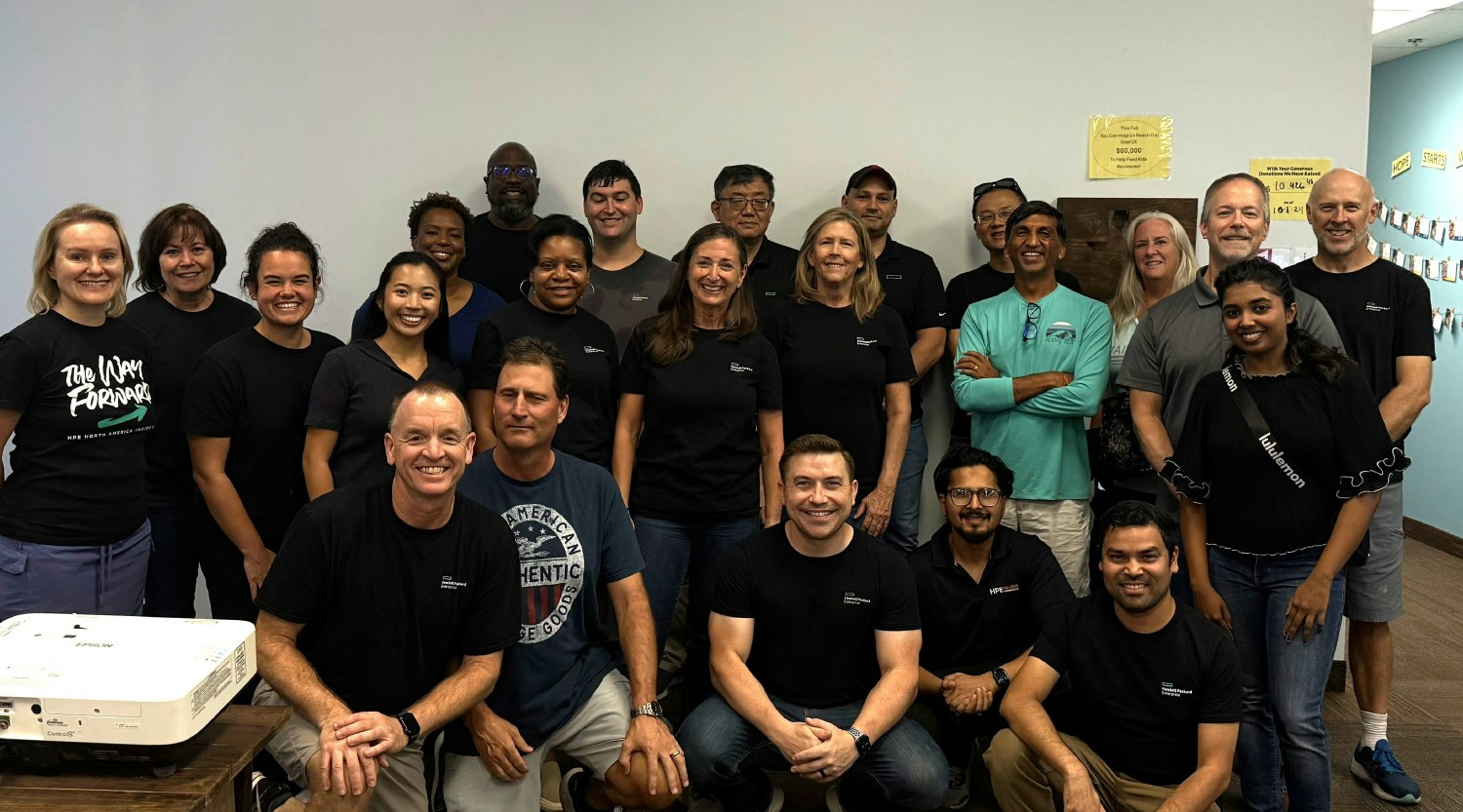 Team members from Frisco, Texas area volunteering for Feed My Starving Children.