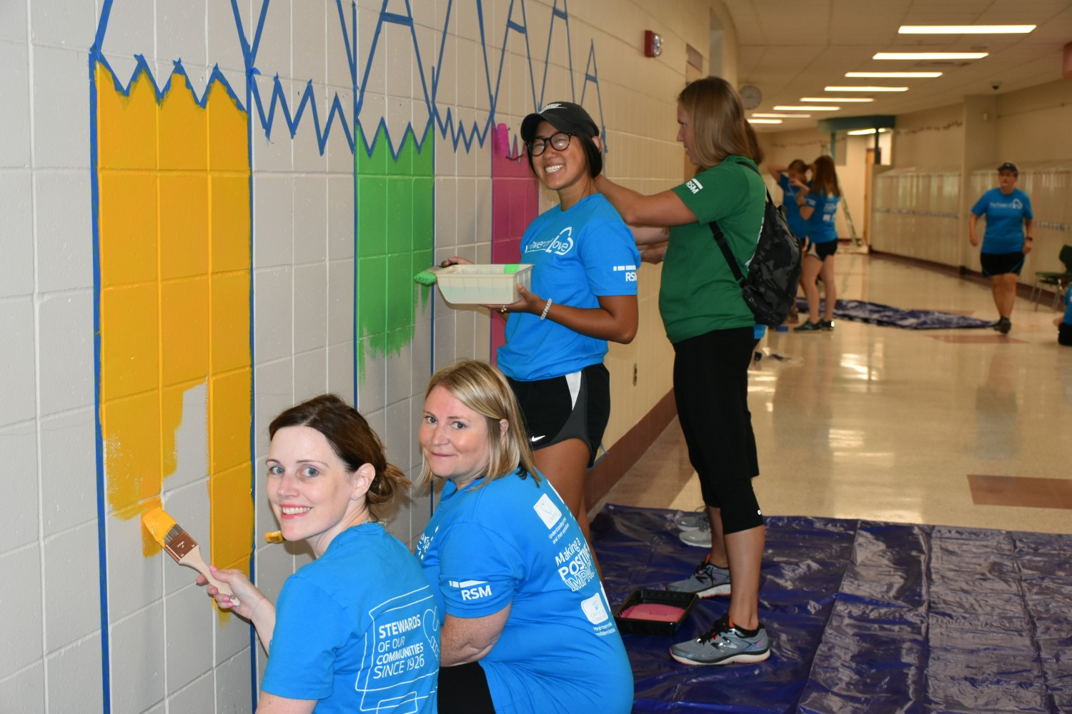 Stewardship is one of RSM's core values as demonstrated by team members who painted a mural at a Minneapolis school.
