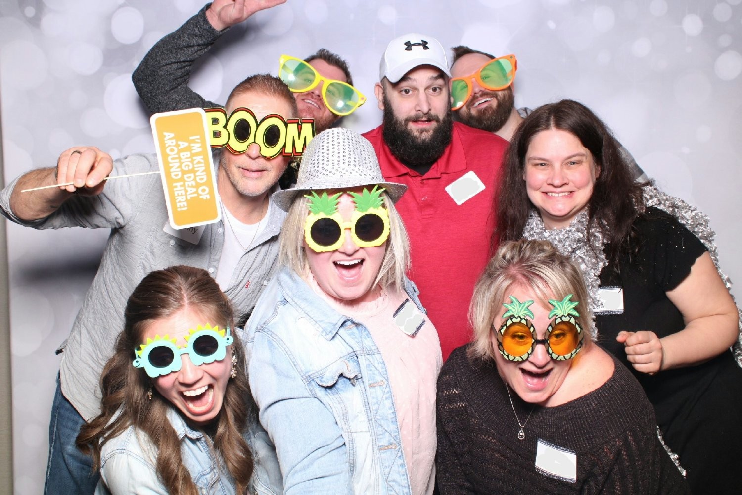 Team members celebrate during our companywide party by having some fun in the photo booth. 