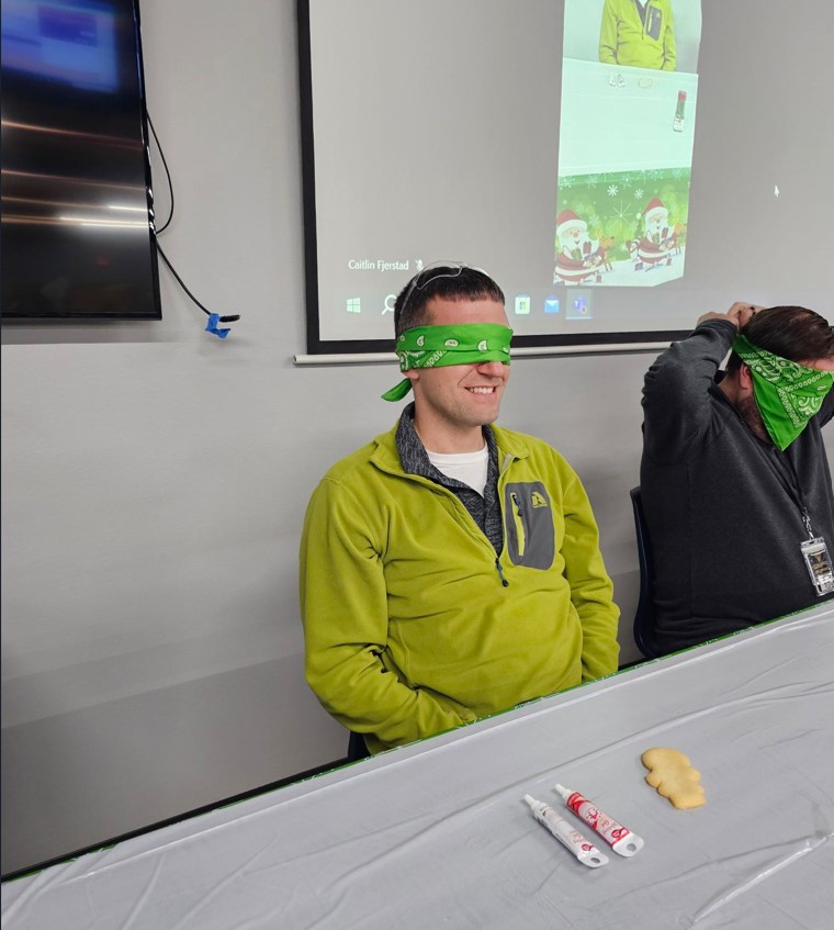Miles, our CEO, participates in a blindfolded cookie decorating contest!