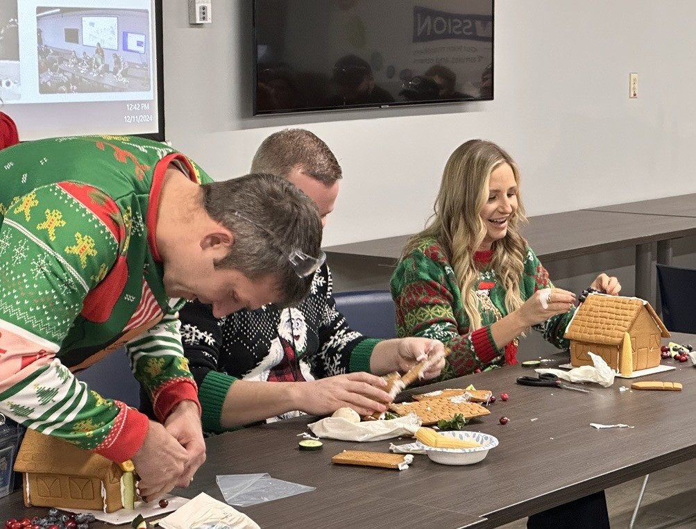 The leadership team competed to create gingerbread houses during the team Christmas Dinner.