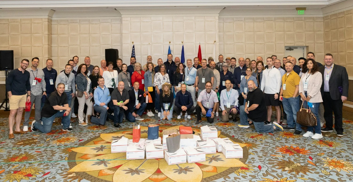Benco Chairmans Level pack care boxes to donate to a local veteran's organization