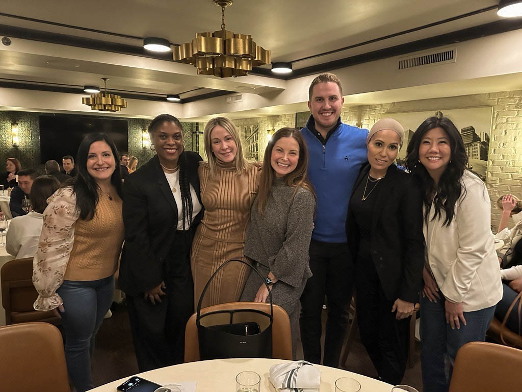 Marketing leaders gathering after a successful Brand Leadership Summit.