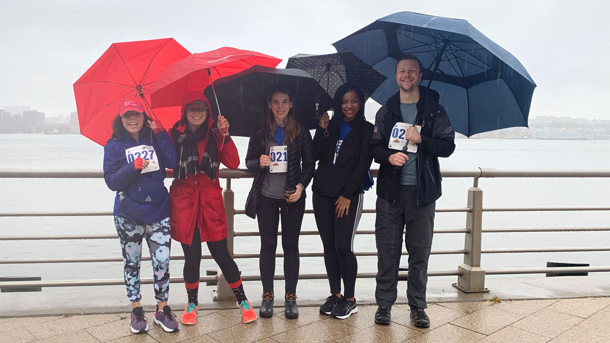 Despite a downpour, Cooley employees and family members support a Birch Family Services 5K Fun Run.