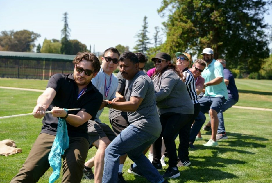 COO Guru Sankararaman joins employees in a lively tug-of-war, showing the true spirit of One Team in action.