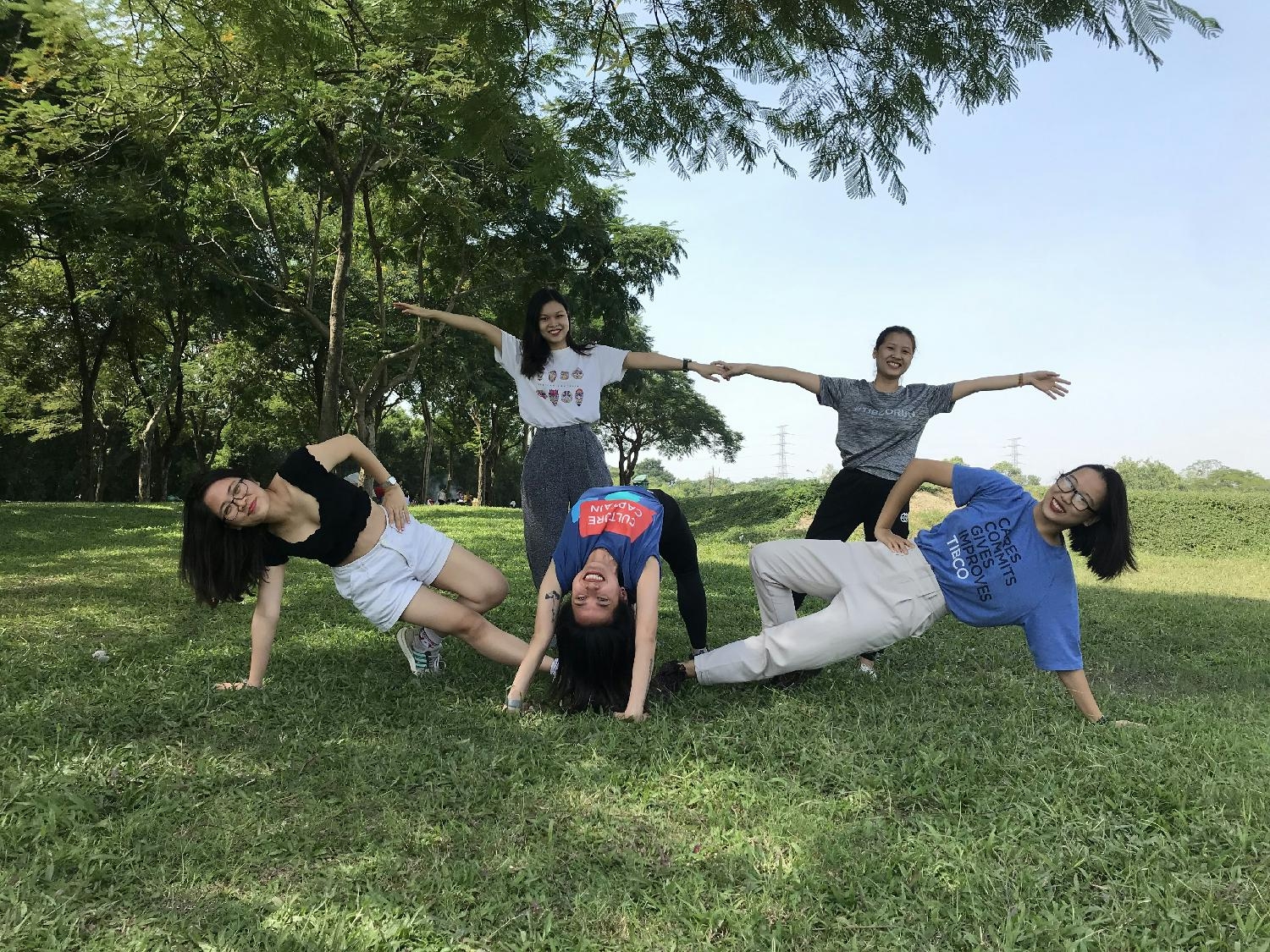Team members in the Hanoi office gather for outdoor yoga.