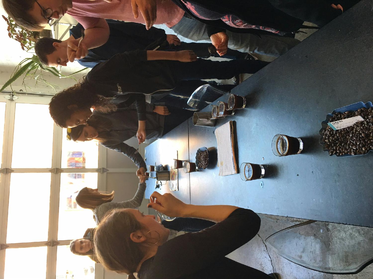 Our team enjoying a cupping event at a local coffee shop.
