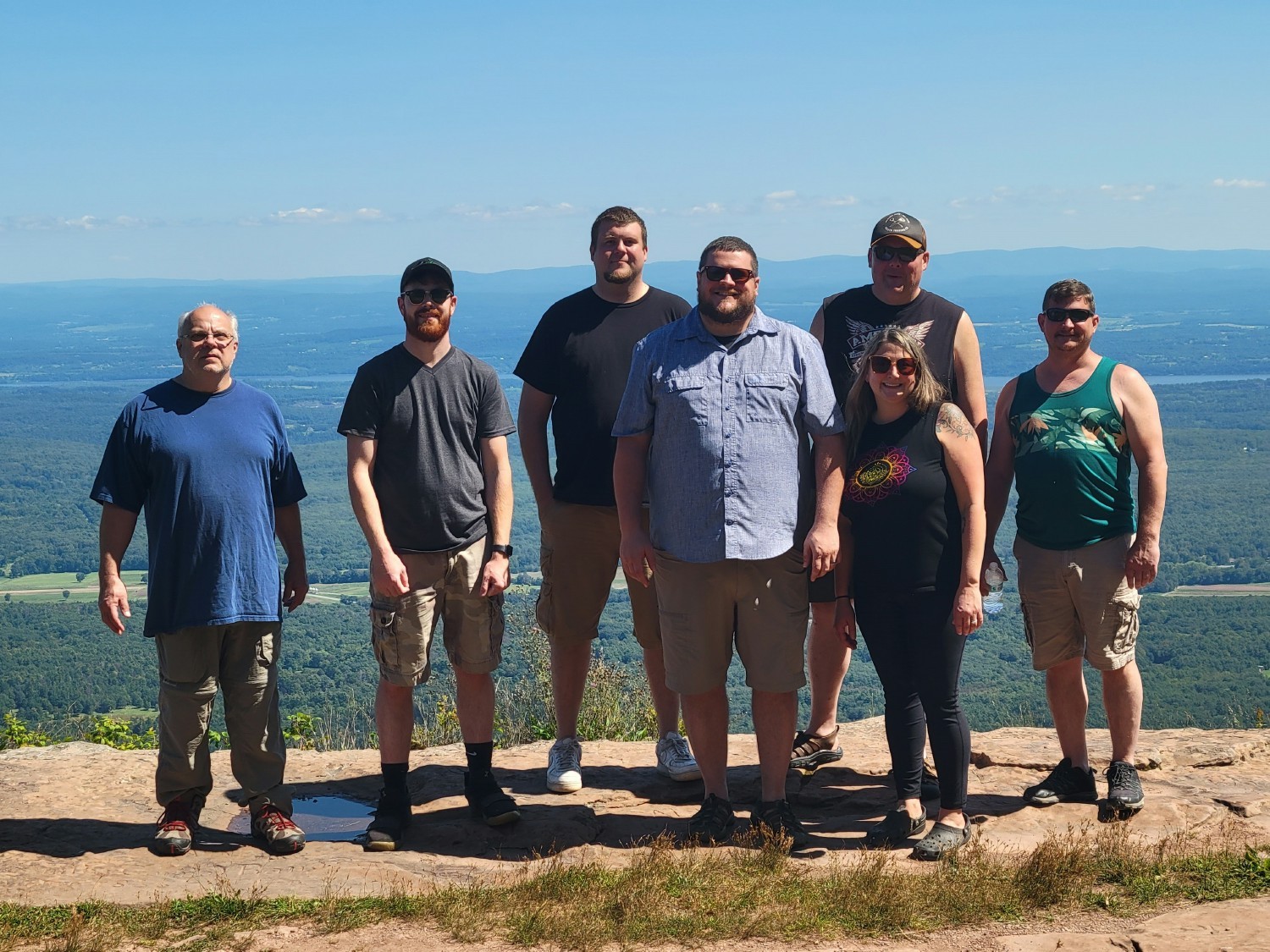 Our Catskill, NY team enjoying summer fun and team building on a hike with a gorgeous backdrop