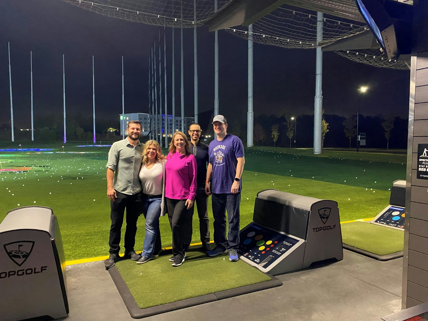 Team bonding, Charlotte style — great swings, big laughs, and even better company.