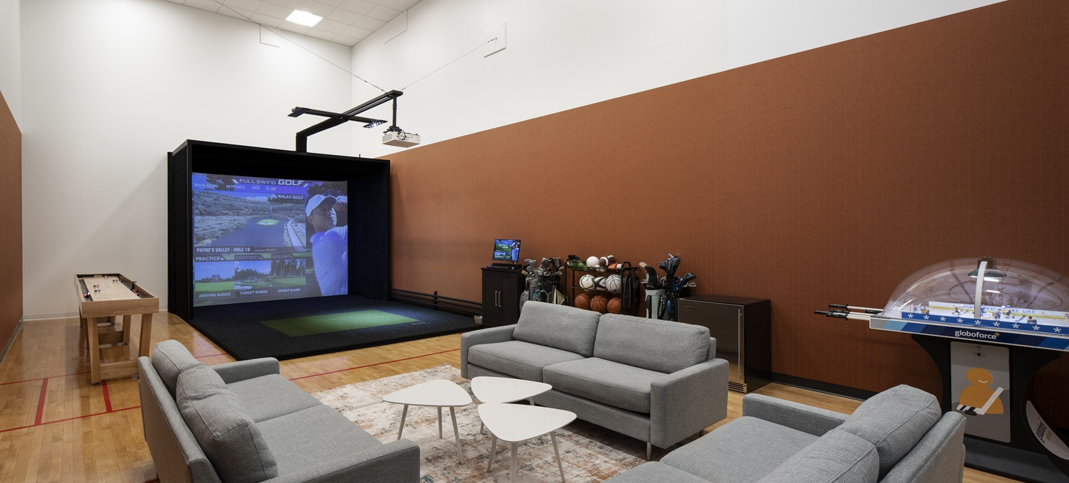 The game room, complete with a golf simulator, is an employee favorite in our new North American headquarters.