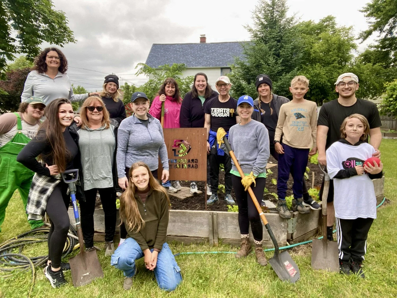 Our Buffalo team volunteering at a community garden, open to anyone, no cost to them offering fresh fruit & vegetables.
