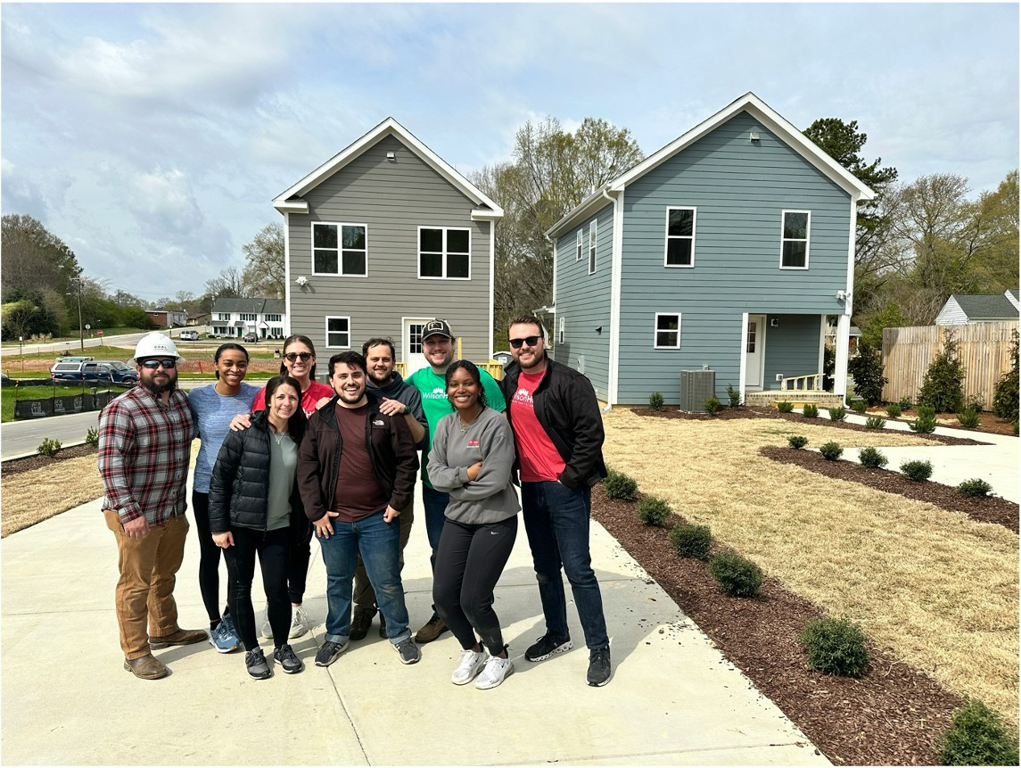 A group of our employees from Raleigh volunteering at habitats for humanity.