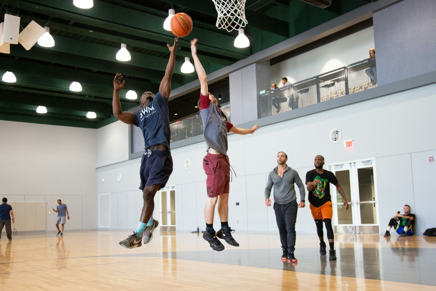 Team members play basketball at UWM's campus 
