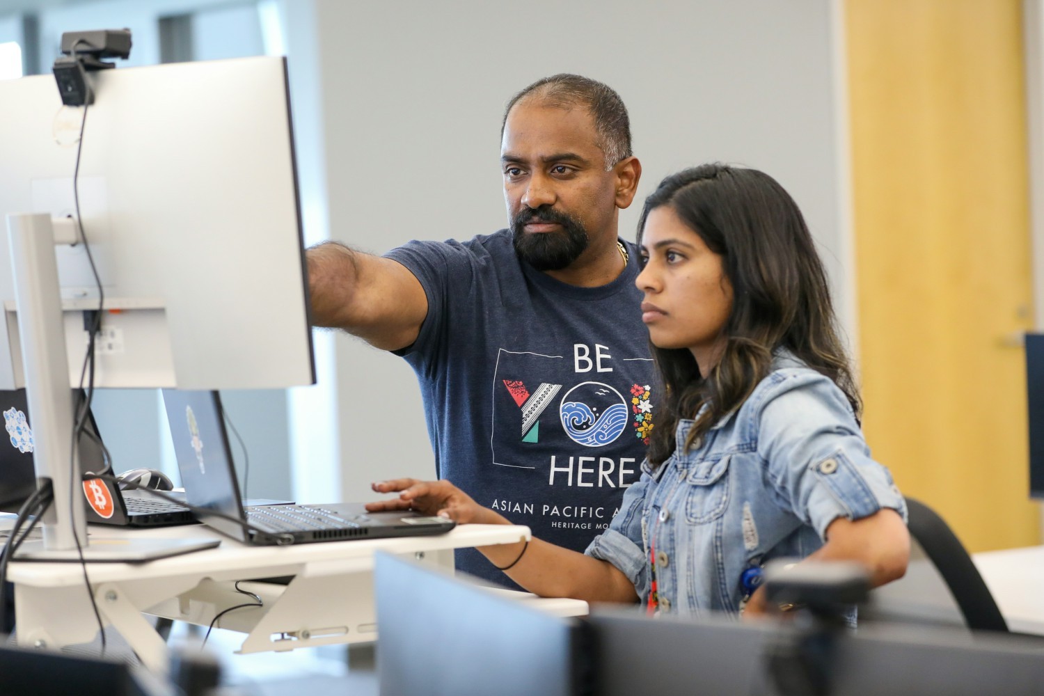 Team members collaborate at UWM's campus