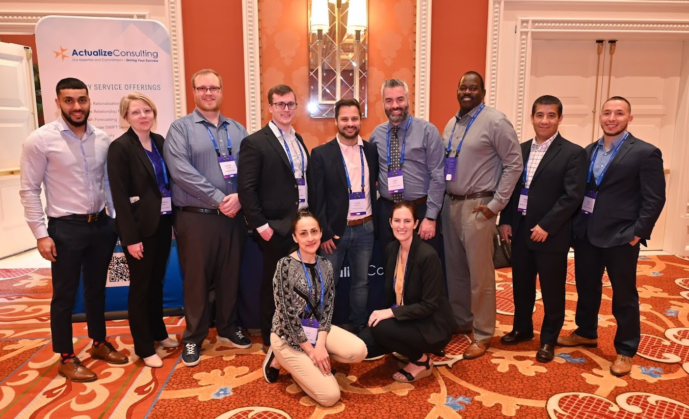 Actualize Consulting attending an industry event. 