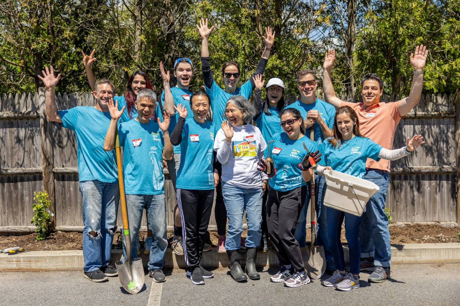 Chief Strategy Officer Ann Stanberry & Chief Information Officer Monica Caldas volunteer alongside Liberty employees