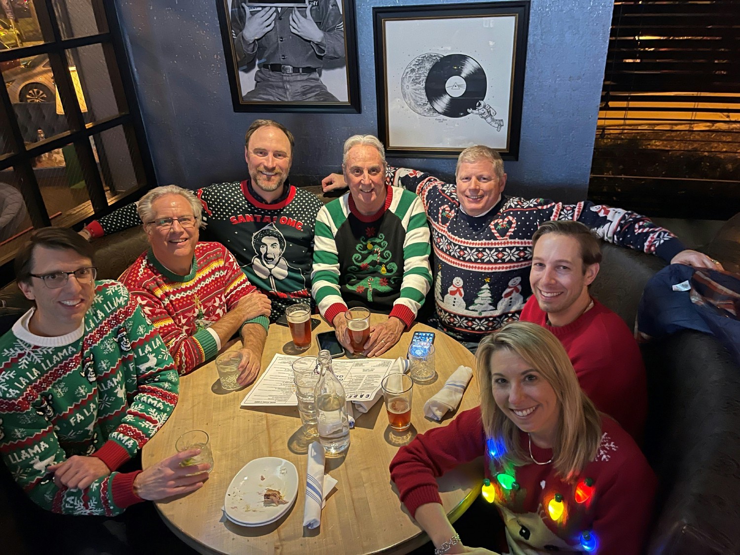 Some of Sevan's leadership team enjoys dinner and an ugly sweater contest during the holidays. 