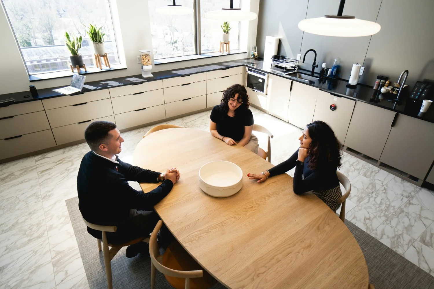 ALKU employees meet to work with one another in open office spaces designed for collaboration and brainstorming. 